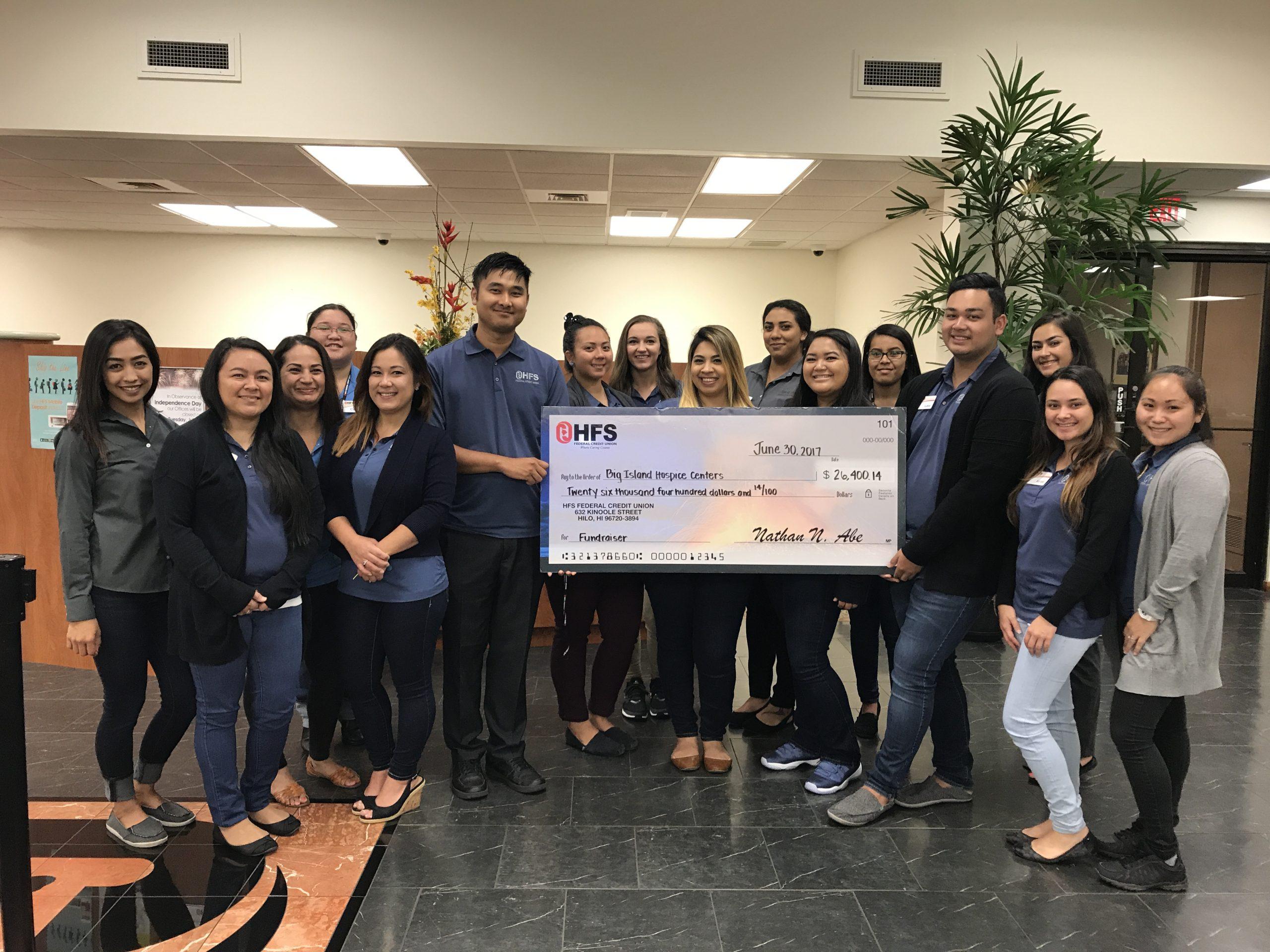 group photo with donation check