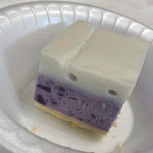a slice of sweet potato haupia sitting in a white bowl