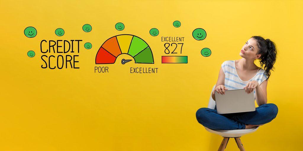 Excellent credit score with young woman using a laptop computer