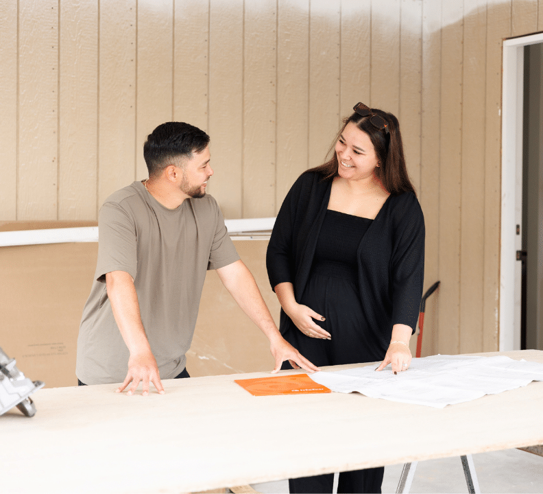 husband and wife at new home during construction