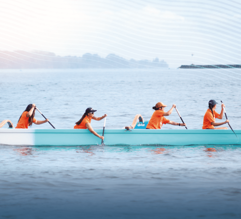 team paddling at hilo bay
